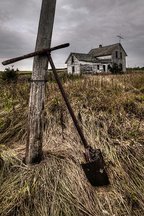 Last Post Hole Dug - Abandoned Stensby homestead with posthole digger propped against pole by Peter Herman Last Post Hole Dug - Abandoned Stensby homestead with posthole digger propped against pole by Peter Herman